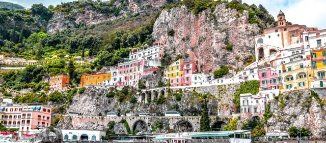 Private transfer vehicle driving along the Amalfi Coast road